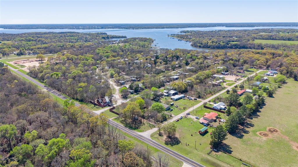 6435 FM 17, Unit 3435 Yantis, TX 75497 - Photo 13 of 14 an aerial view of residential houses with outdoor space