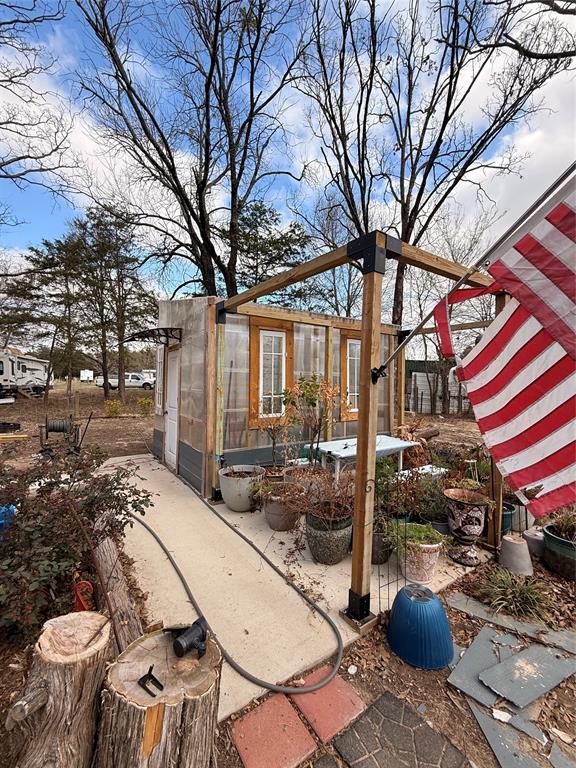 6435 FM 17, Unit 3435 Yantis, TX 75497 - Photo 2 of 14 a view of a chairs and table in backyard