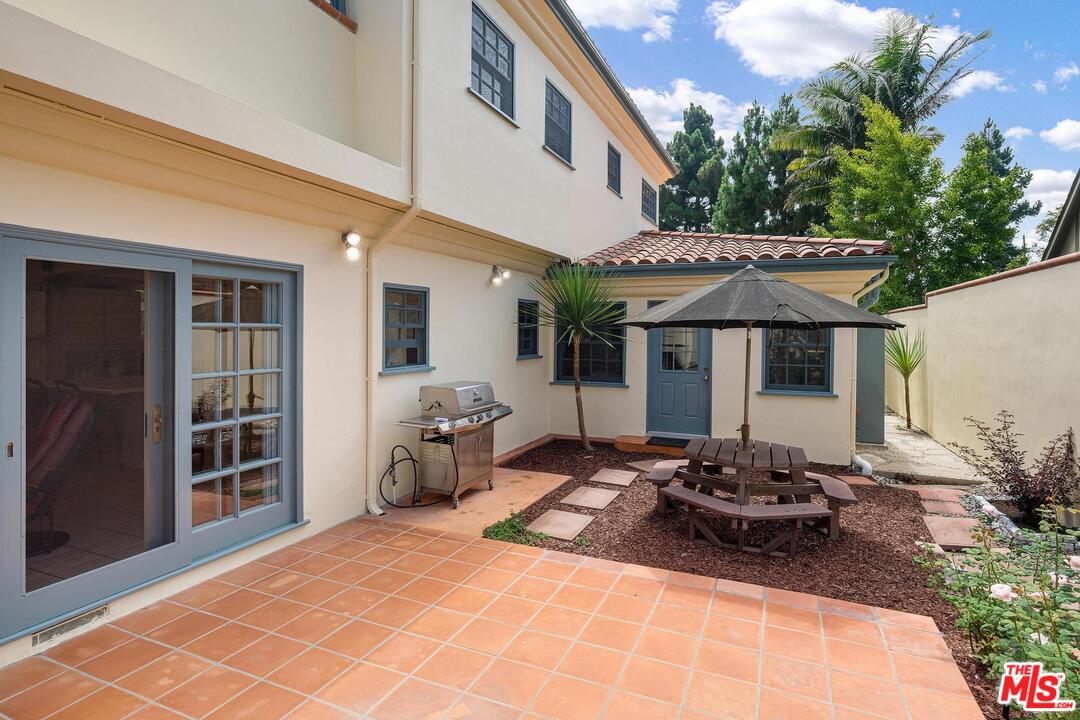 323 9th Street Santa Monica, CA 90402 - Photo 14 of 16 a front view of a house with patio furniture and garden