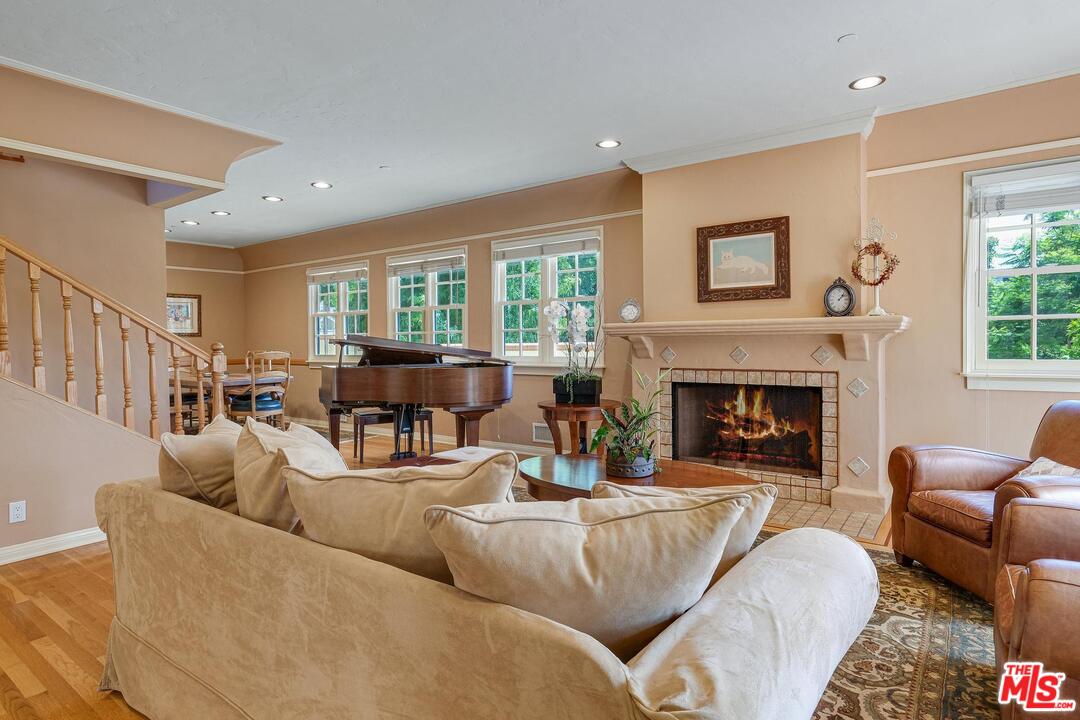 323 9th Street Santa Monica, CA 90402 - Photo 4 of 16 a living room with furniture fireplace and a large window