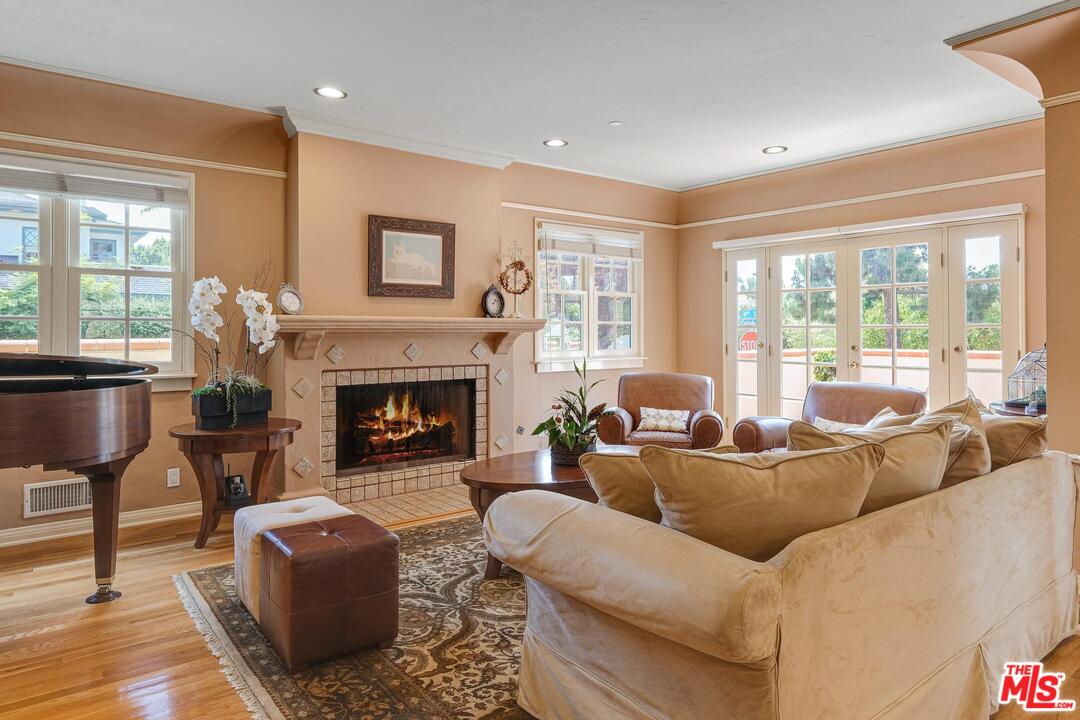 323 9th Street Santa Monica, CA 90402 - Photo 5 of 16 a living room with furniture a large window and a fireplace