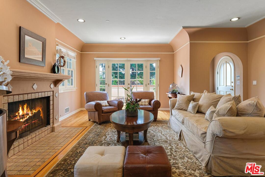 323 9th Street Santa Monica, CA 90402 - Photo 6 of 16 a living room with furniture fireplace and a large window