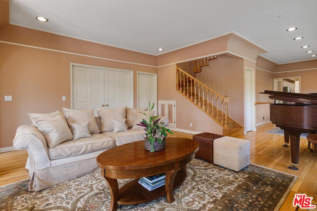 323 9th Street Santa Monica, CA 90402 - Photo 7 of 16 a living room with furniture and wooden floor