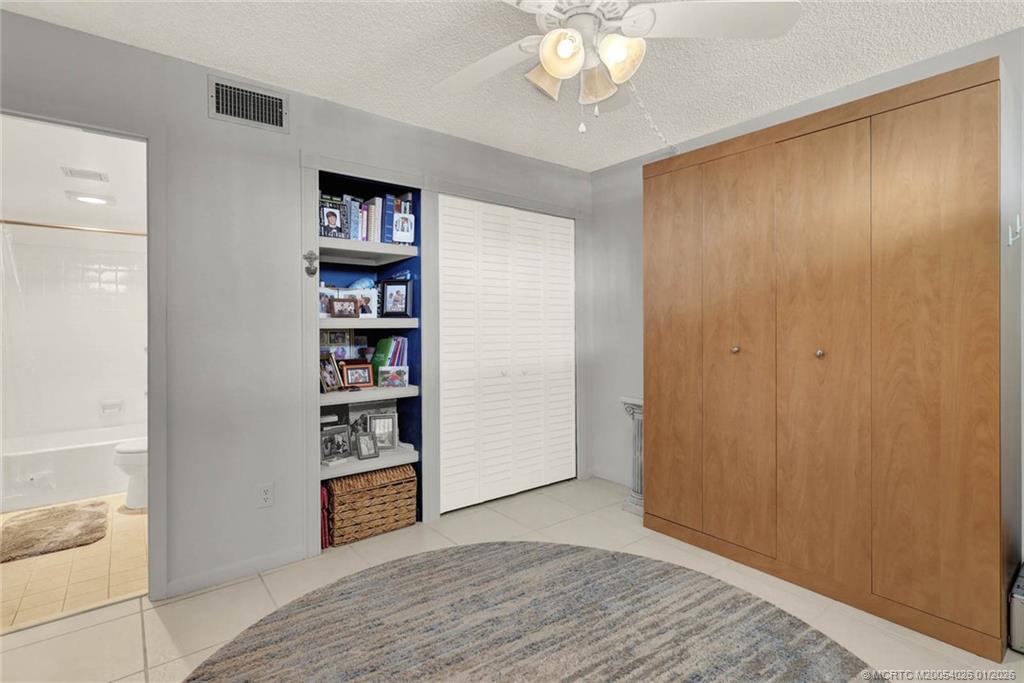 1950 Southwest Palm City Road, Unit 8106 Stuart, FL 34994 - Photo 35 of 54 a view of an empty room with cabinet and a window