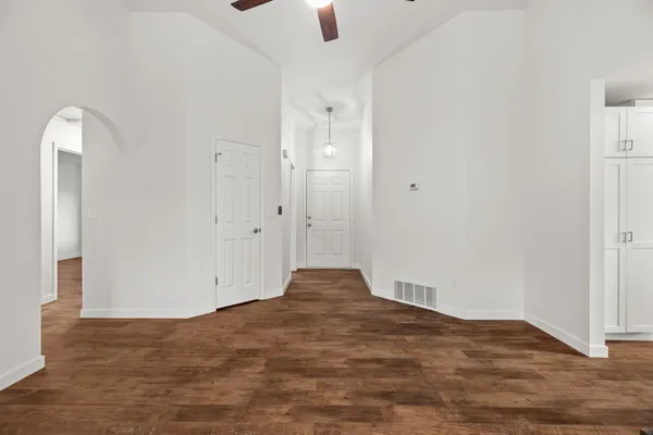 a view of room with hardwood floor and window