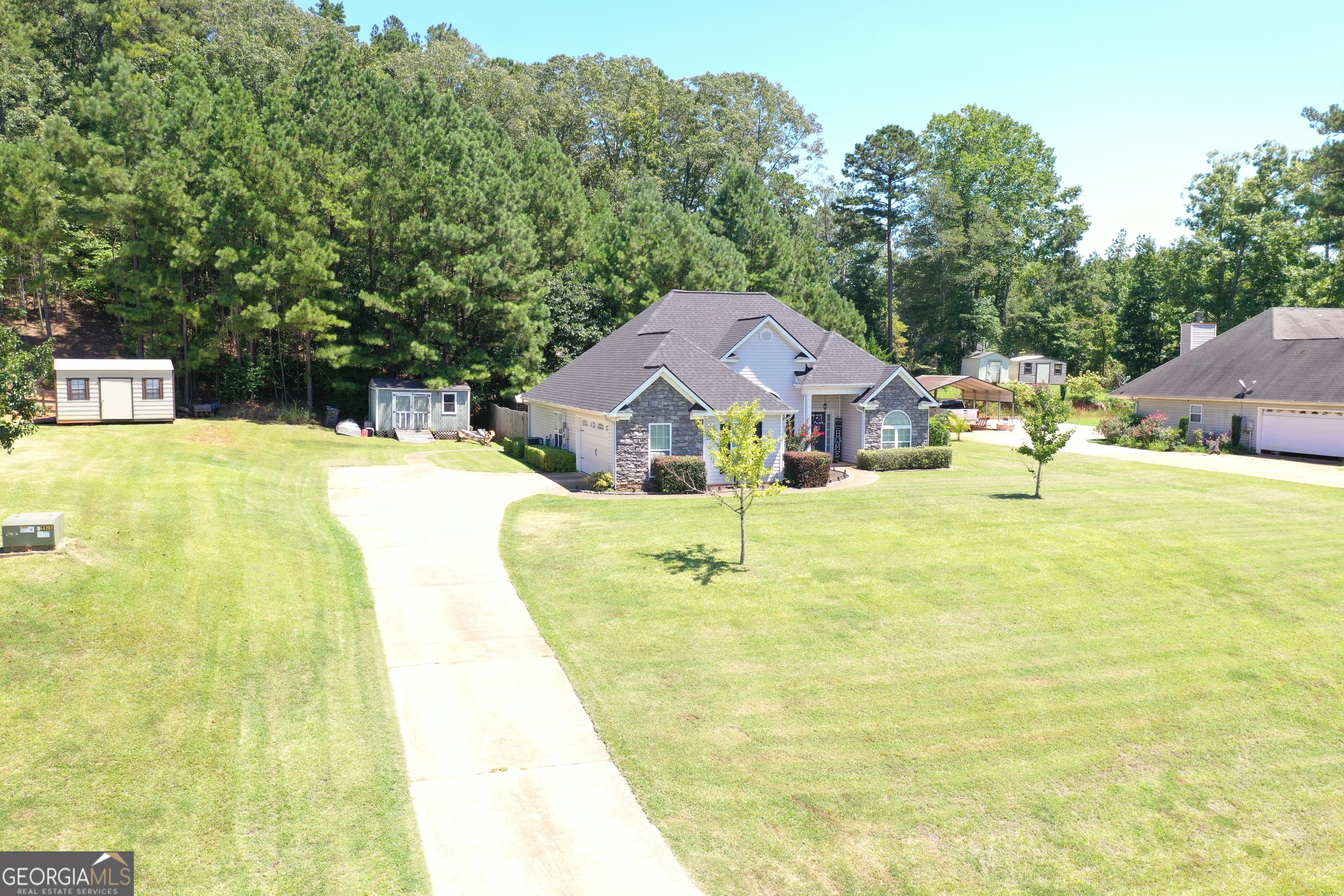 229 John Lovelace Road LaGrange, GA 30241 - Photo 46 of 59 a swimming pool with trees in the background