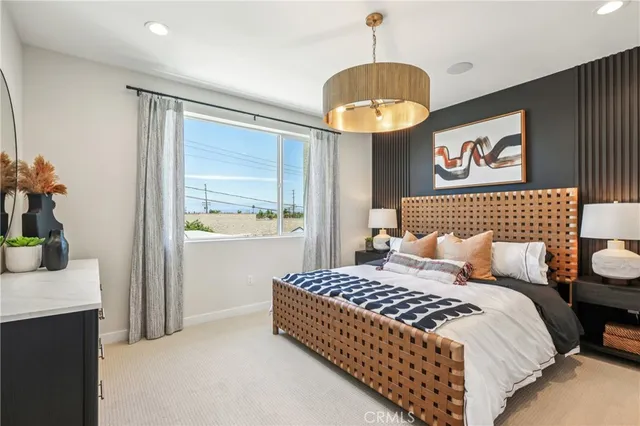 a bedroom with a bed and a table