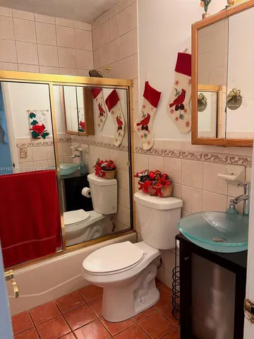 a bathroom with a toilet and a sink