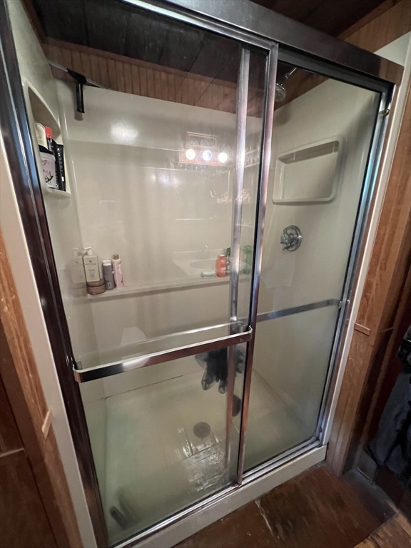 128 Danforth Street Rehoboth, MA 02769 - Photo 15 of 39 a bathroom with a glass shower door