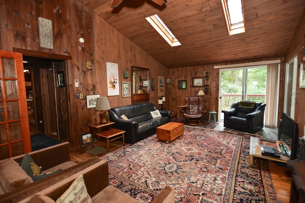 128 Danforth Street Rehoboth, MA 02769 - Photo 16 of 39 a living room with furniture fireplace and a flat screen tv