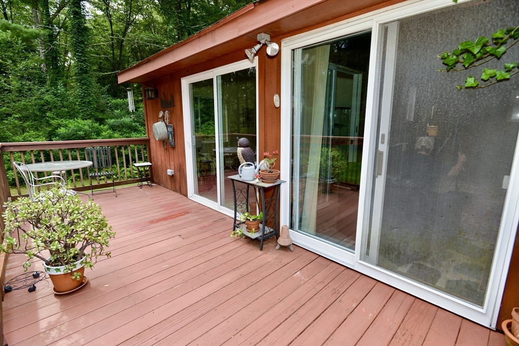 128 Danforth Street Rehoboth, MA 02769 - Photo 19 of 39 a view of a deck with wooden floor and outdoor seating