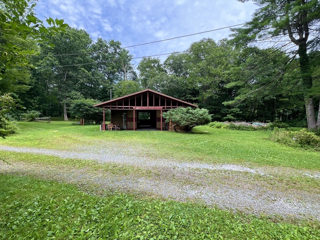 128 Danforth Street Rehoboth, MA 02769 - Photo 30 of 39 a view of a house with backyard and trees