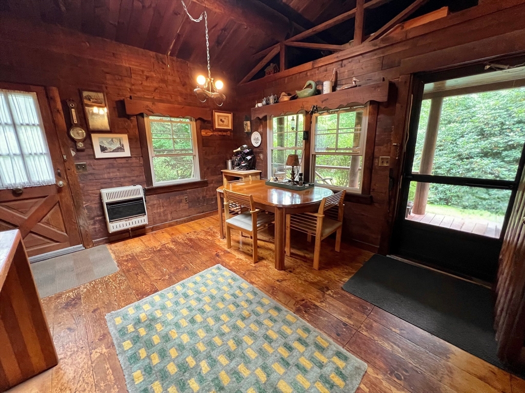 128 Danforth Street Rehoboth, MA 02769 - Photo 9 of 39 a living room with furniture a fireplace and a table