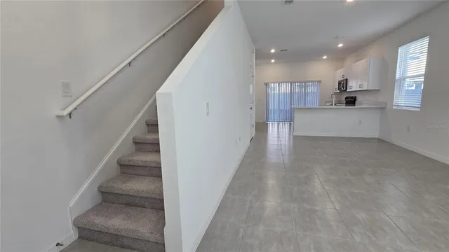 a view of entryway and kitchen