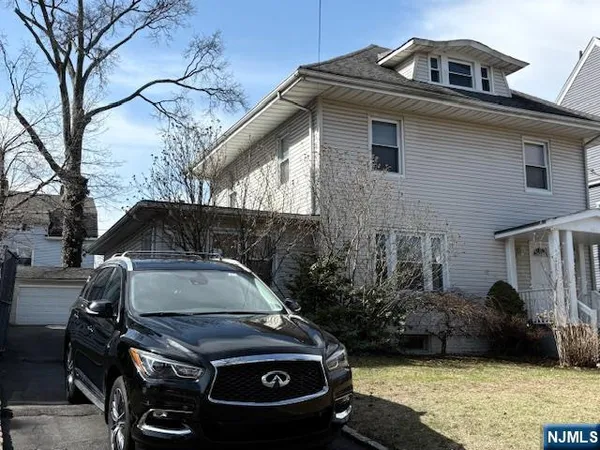 a car parked in front of a house