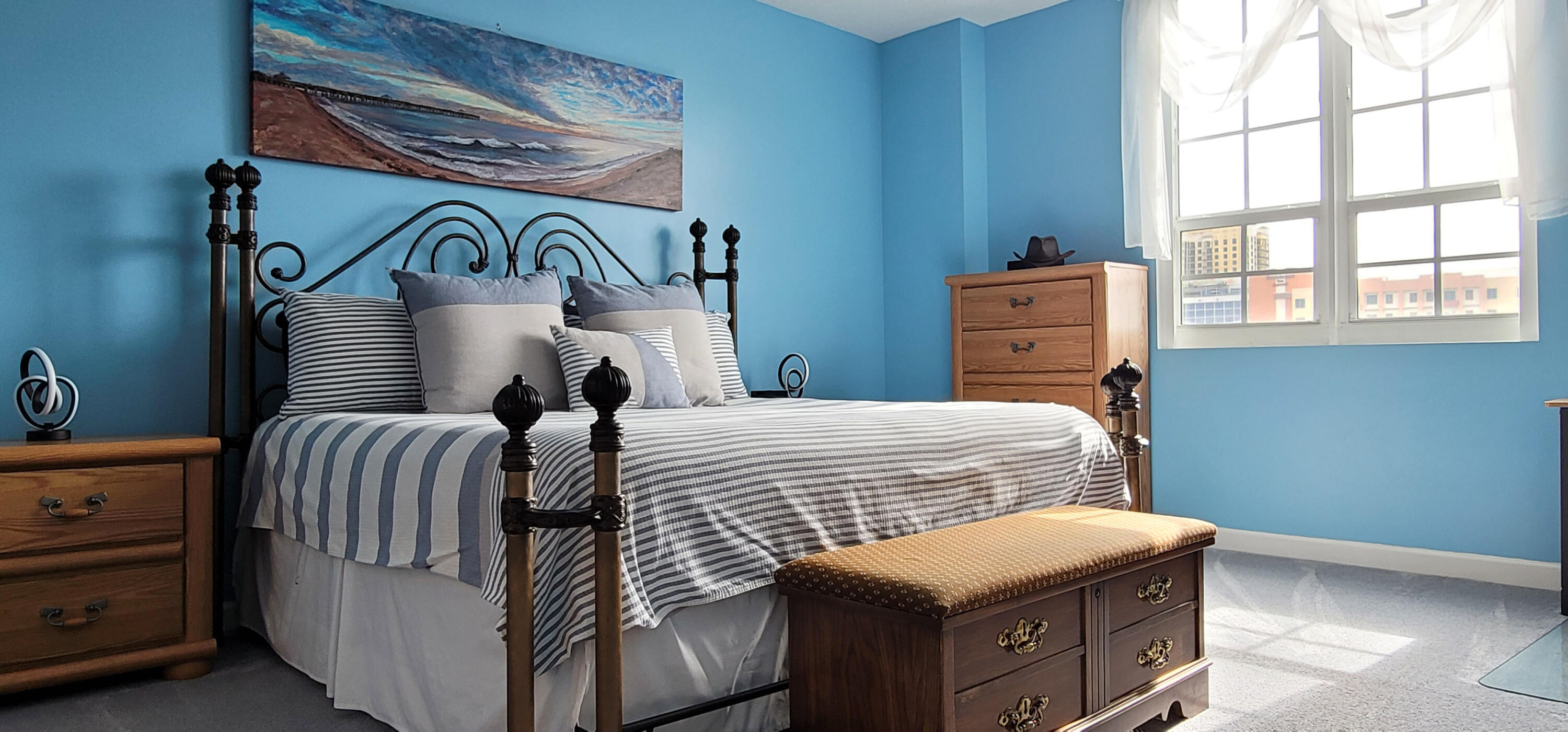 410 Evernia Street, Unit 519 West Palm Beach, FL 33401 - Photo 11 of 27 a bedroom with two beds and a window