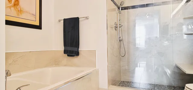 a bedroom with a bed and a book shelf