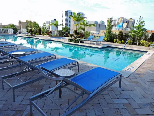 a view of swimming pool with outdoor seating