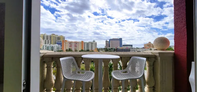 a view of a balcony with a table and chairs