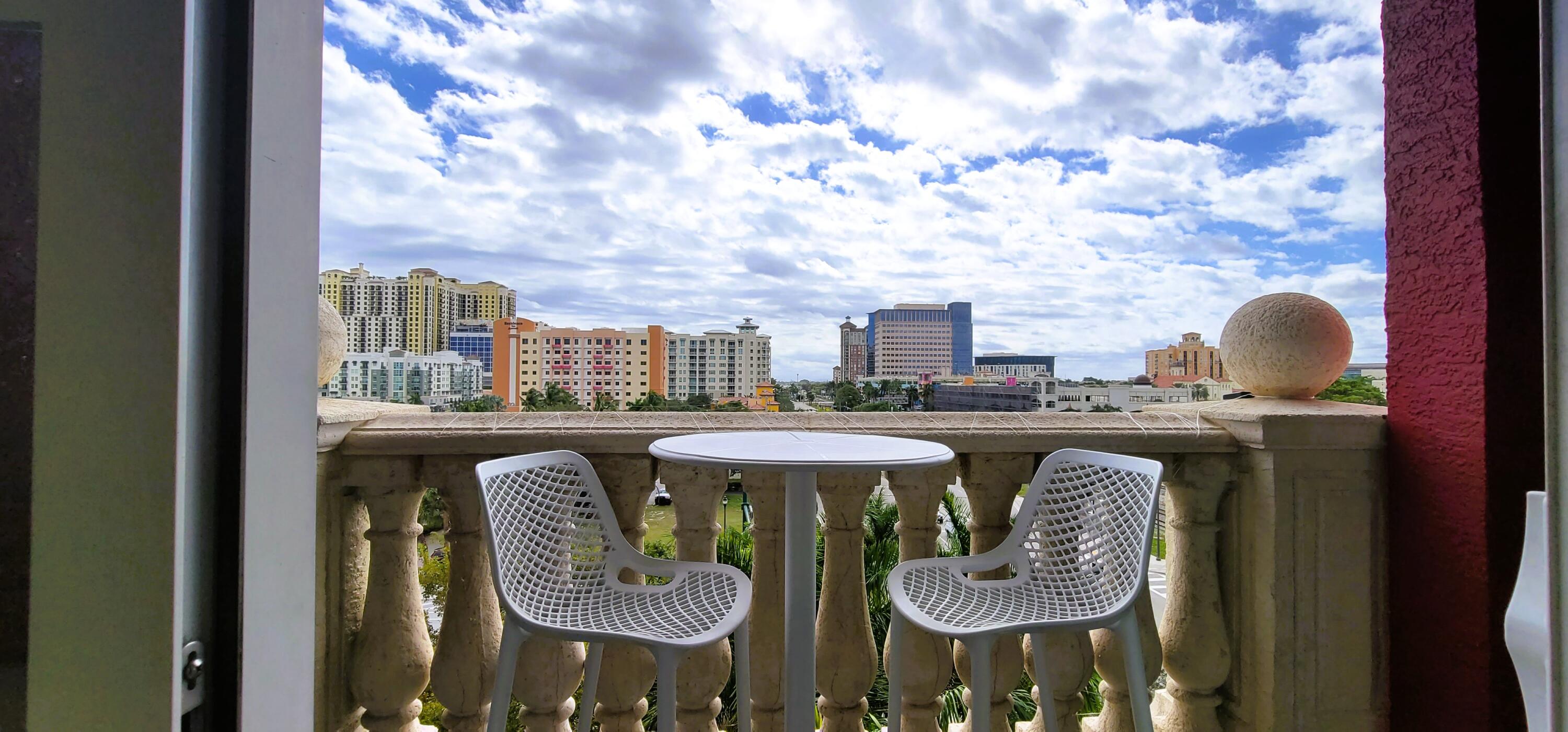 410 Evernia Street, Unit 519 West Palm Beach, FL 33401 - Photo 9 of 27 a close view of dining table chairs and wooden floor