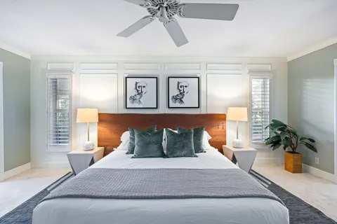 a bedroom with furniture and a window