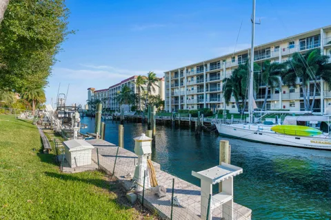 a house view with a swimming pool and glass windows