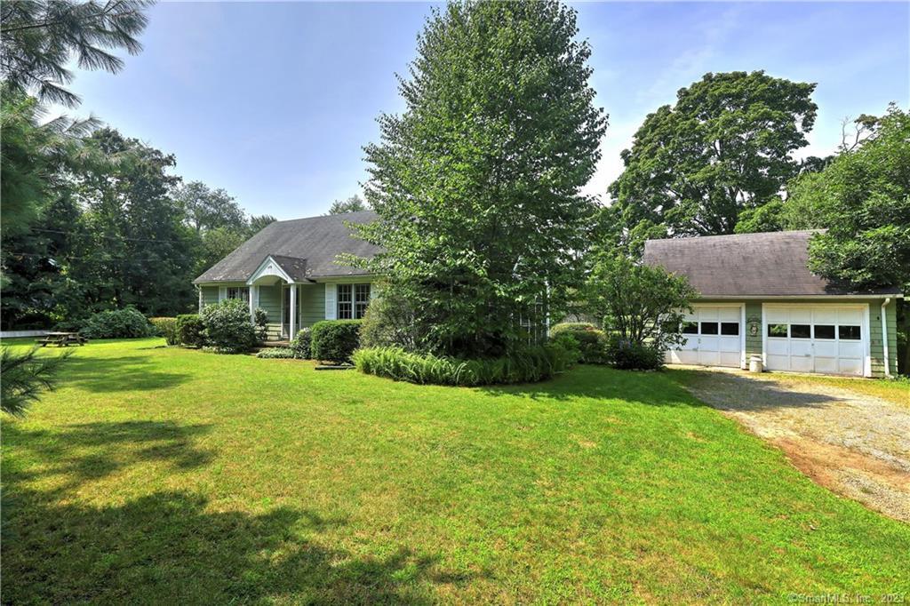 479 Wheeler Road Monroe, CT 06468 - Photo 1 of 1 a front view of a house with yard and green space