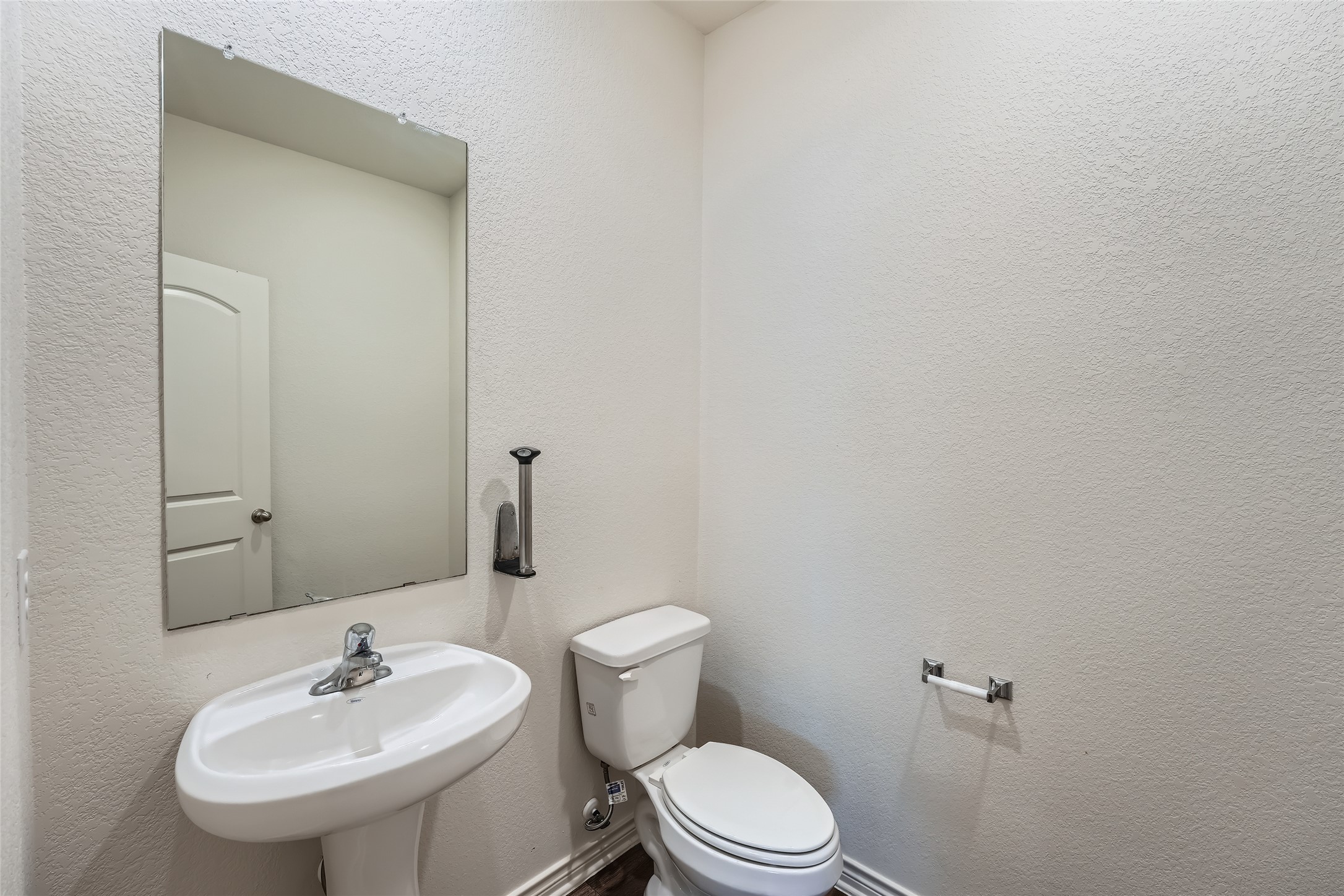 14513 Prairie Sod Lane Elgin, TX 78621 - Photo 12 of 36 a bathroom with a sink a toilet and a mirror