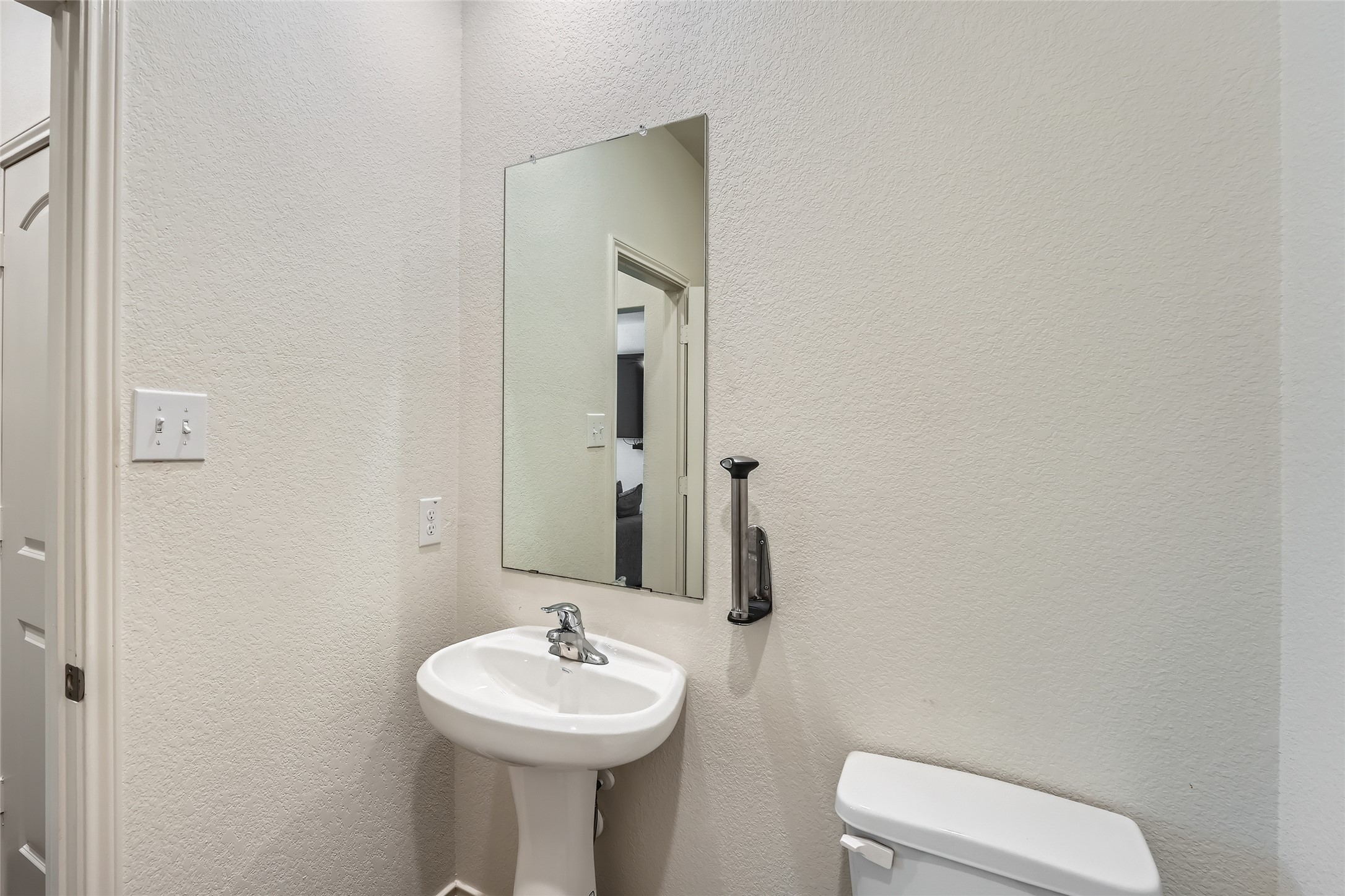 14513 Prairie Sod Lane Elgin, TX 78621 - Photo 13 of 36 a bathroom with a sink toilet and mirror