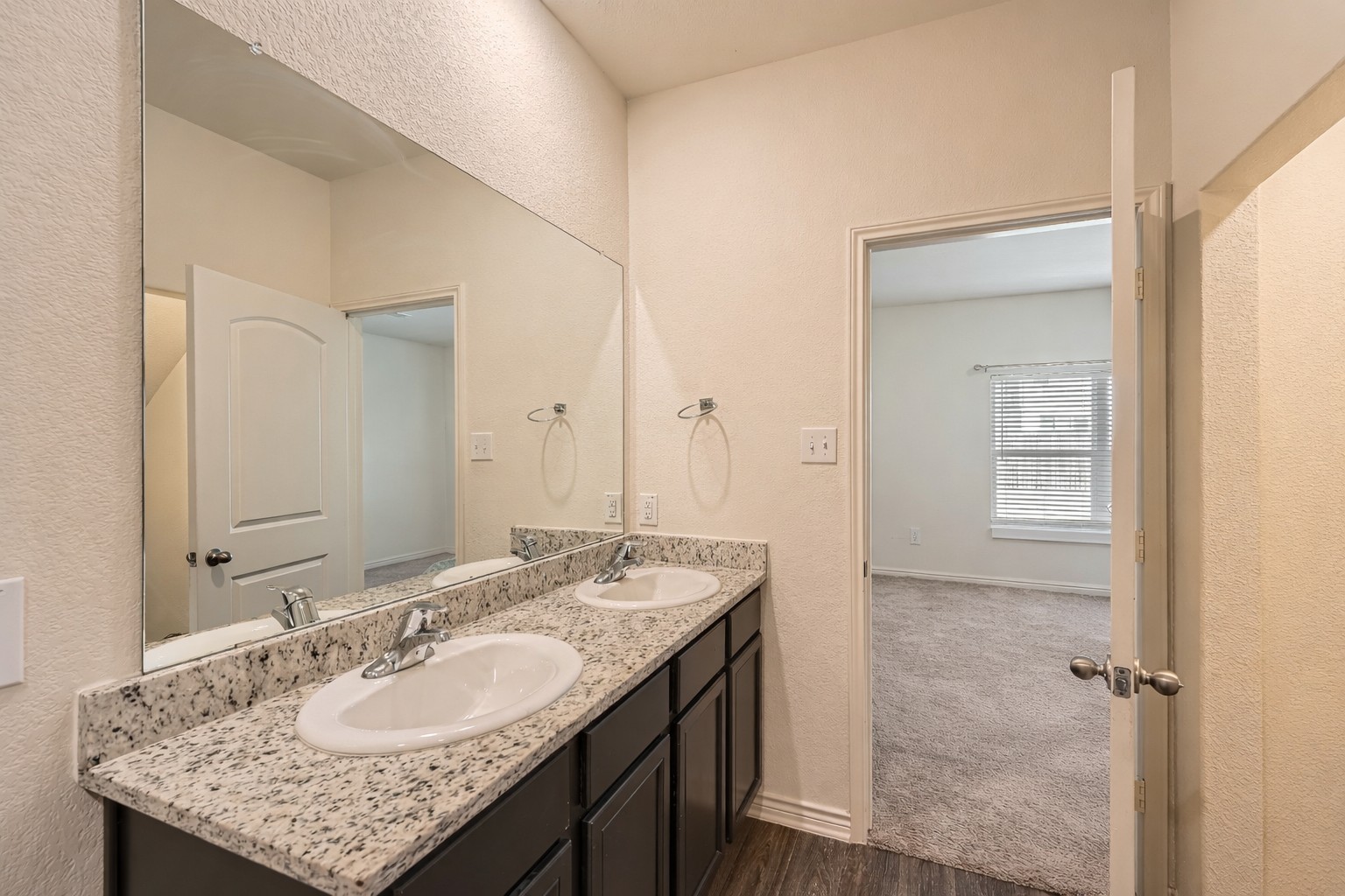 14513 Prairie Sod Lane Elgin, TX 78621 - Photo 17 of 36 a bathroom with a granite countertop sink and a mirror