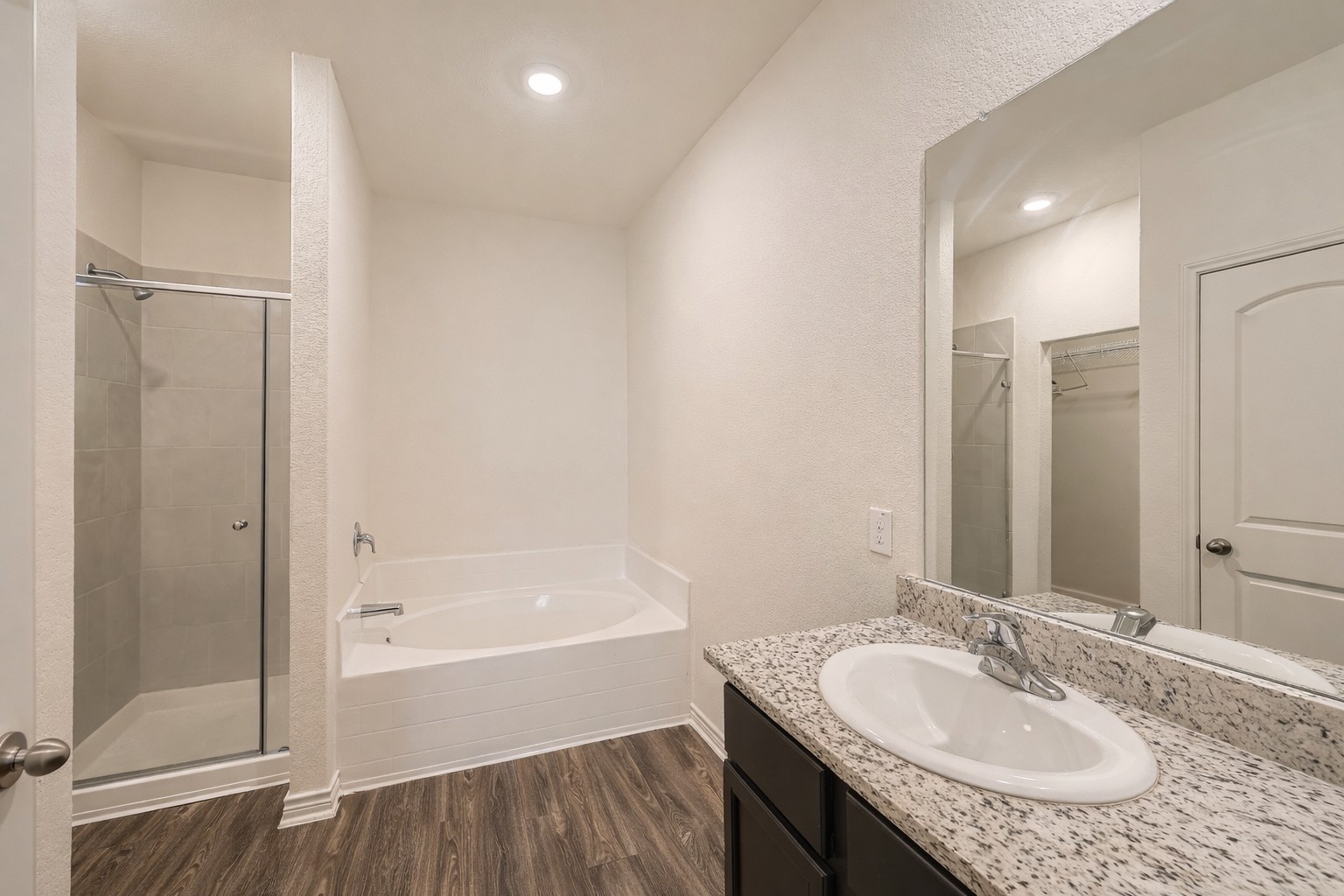 14513 Prairie Sod Lane Elgin, TX 78621 - Photo 18 of 36 a bathroom with a granite countertop sink and a mirror