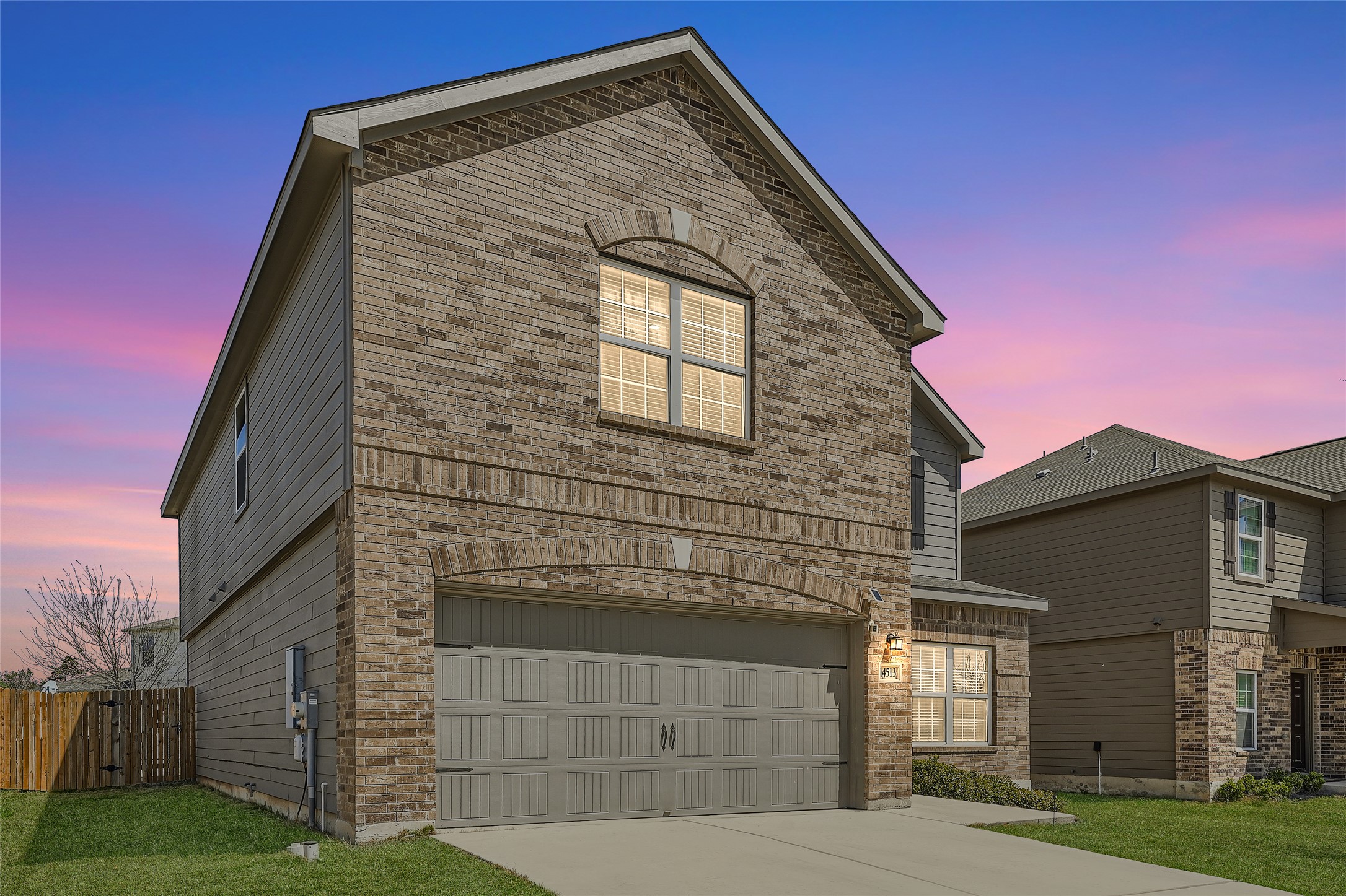 14513 Prairie Sod Lane Elgin, TX 78621 - Photo 2 of 36 a front view of a house with a yard