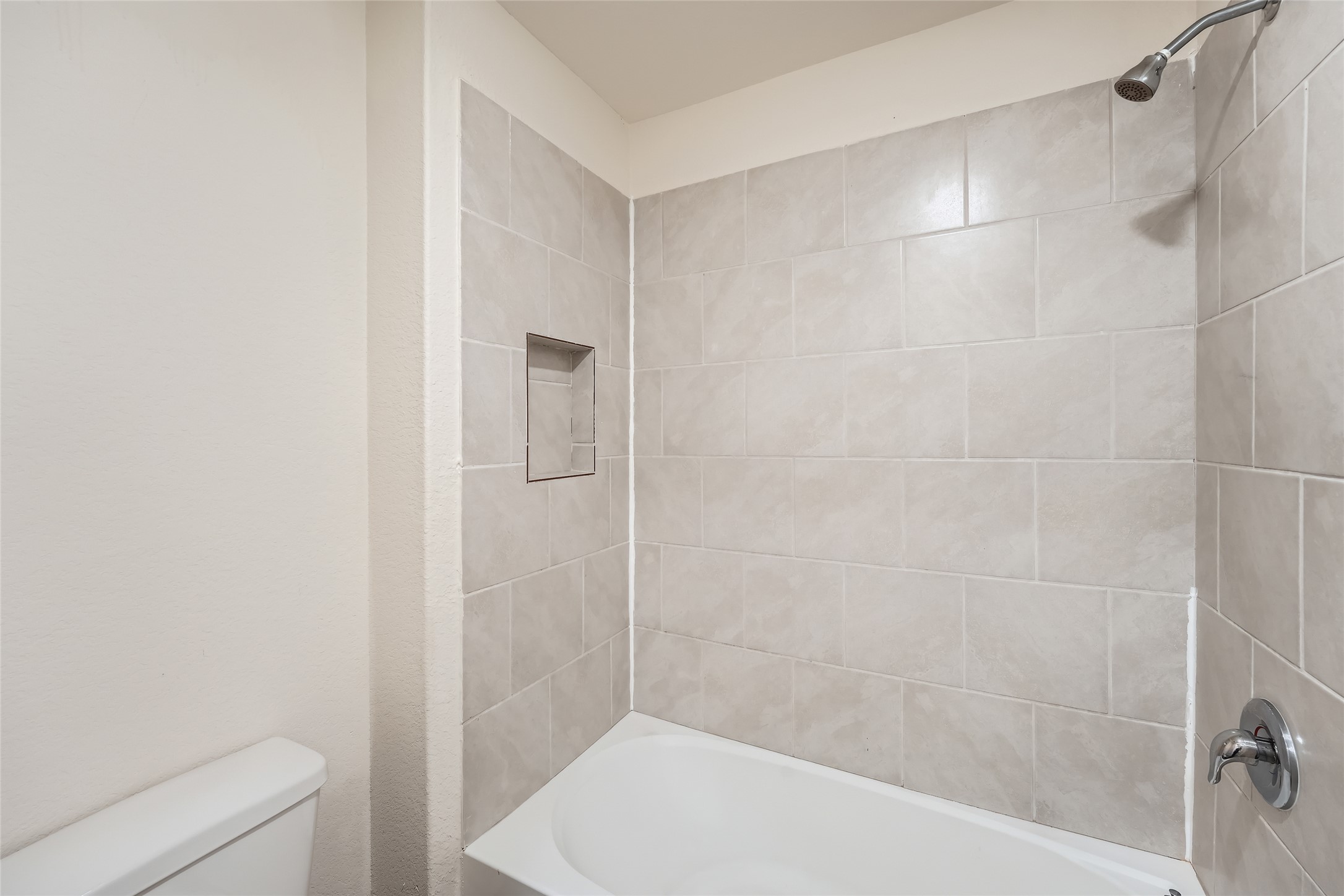 14513 Prairie Sod Lane Elgin, TX 78621 - Photo 28 of 36 a bathroom with a shower and a toilet