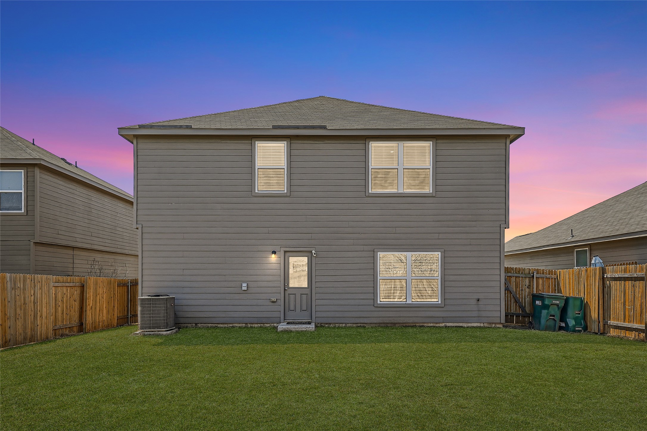 14513 Prairie Sod Lane Elgin, TX 78621 - Photo 35 of 36 a view of a house with a yard