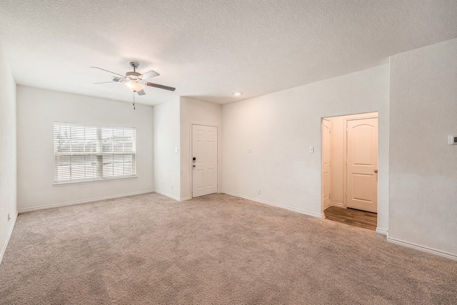 14513 Prairie Sod Lane Elgin, TX 78621 - Photo 6 of 36 a view of an empty room with a window