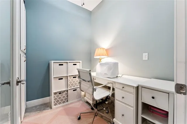 a view of a workspace with furniture