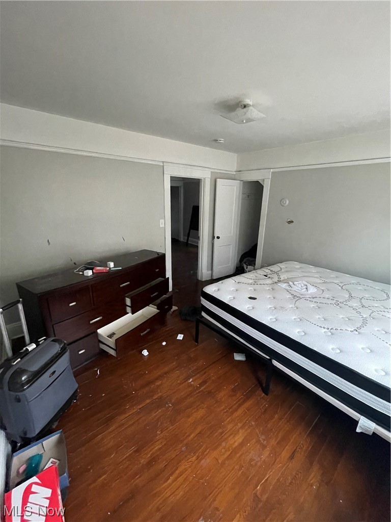 3185 Sycamore Road Cleveland, OH 44118 - Photo 20 of 33 Bedroom with dark hardwood / wood-style floors and a closet
