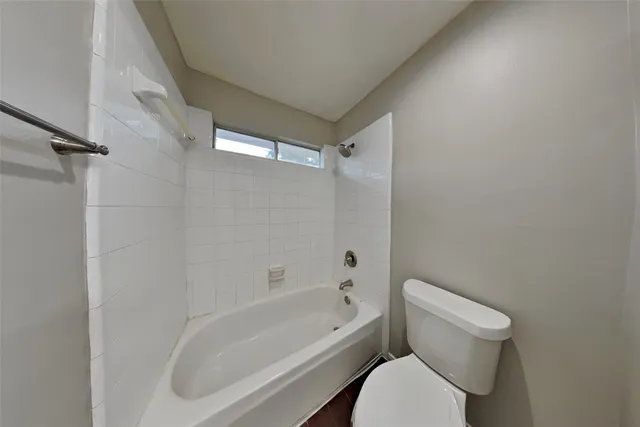 a spacious bathroom with a double vanity sink and mirror