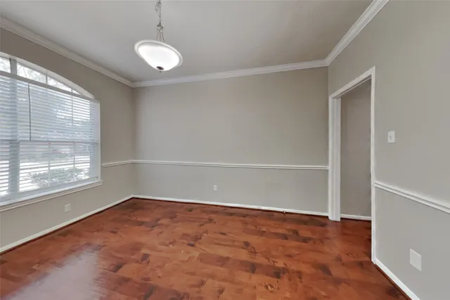 an empty room with a empty space and windows