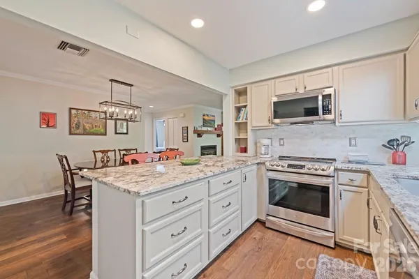 a kitchen with a stove and cabinets
