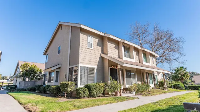 a front view of a house with garden