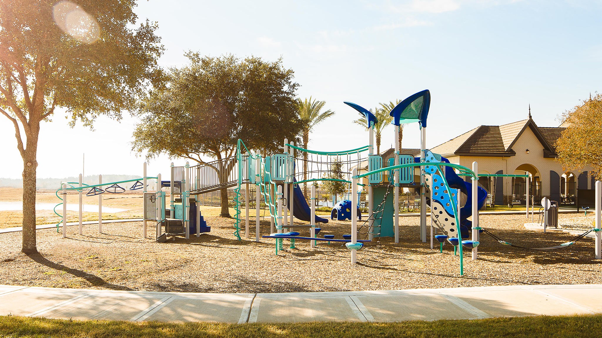 20514 Bronco Rdg Drive Tomball, TX 77377 - Photo 14 of 19 a view of a park with swings and slides