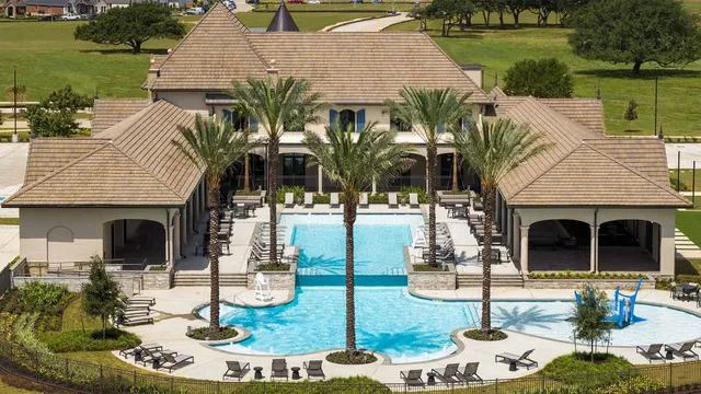 an aerial view of a house swimming pool patio and outdoor seating