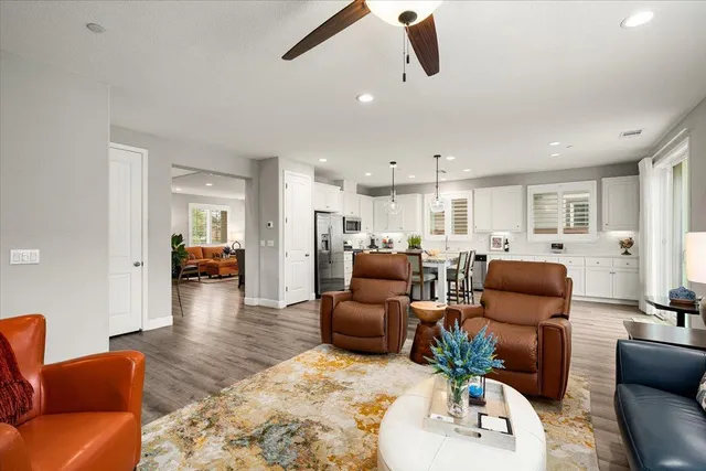 a living room with furniture a window and gym equipment