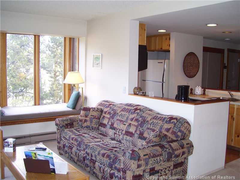 22340 Highway 6, Unit 1815 Keystone, CO 80435 - Photo 5 of 12 a bedroom with a large bed and a window