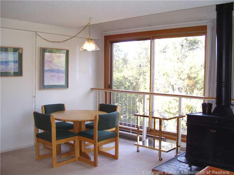 22340 Highway 6, Unit 1815 Keystone, CO 80435 - Photo 6 of 12 a view of a dining room with furniture window and outside view