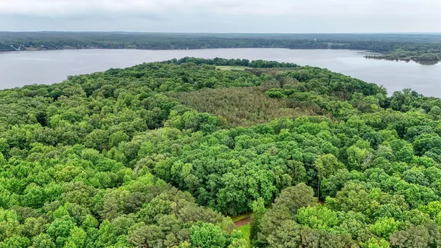a view of a lake with a yard