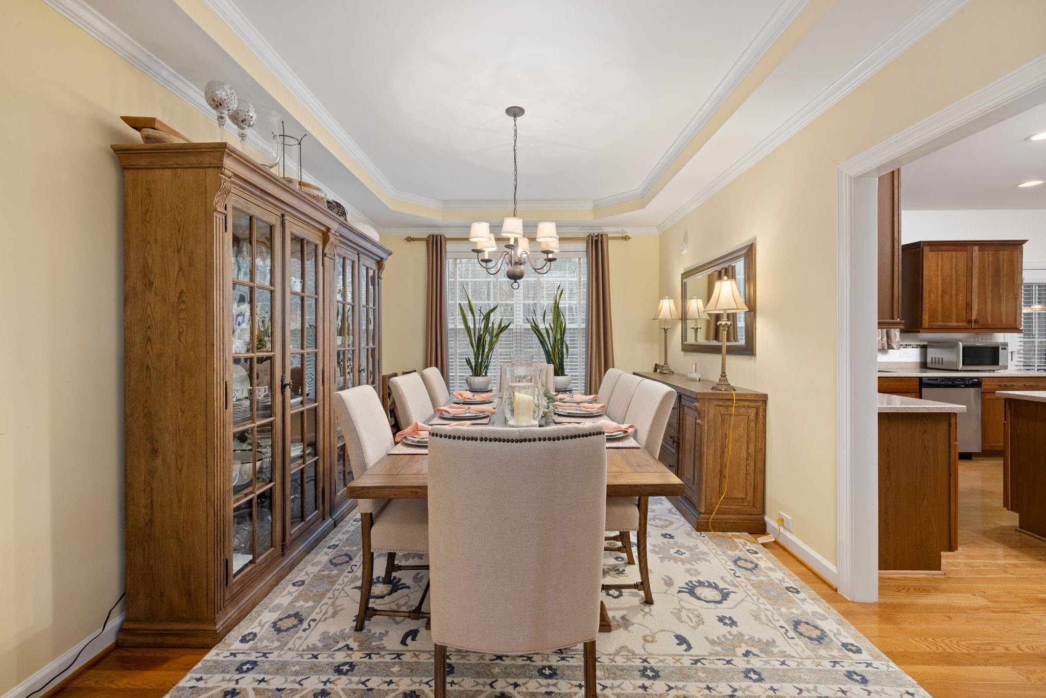 1621 Timber Wolf Drive Durham, NC 27713 - Photo 16 of 48 a dining room with furniture a chandelier and wooden floor