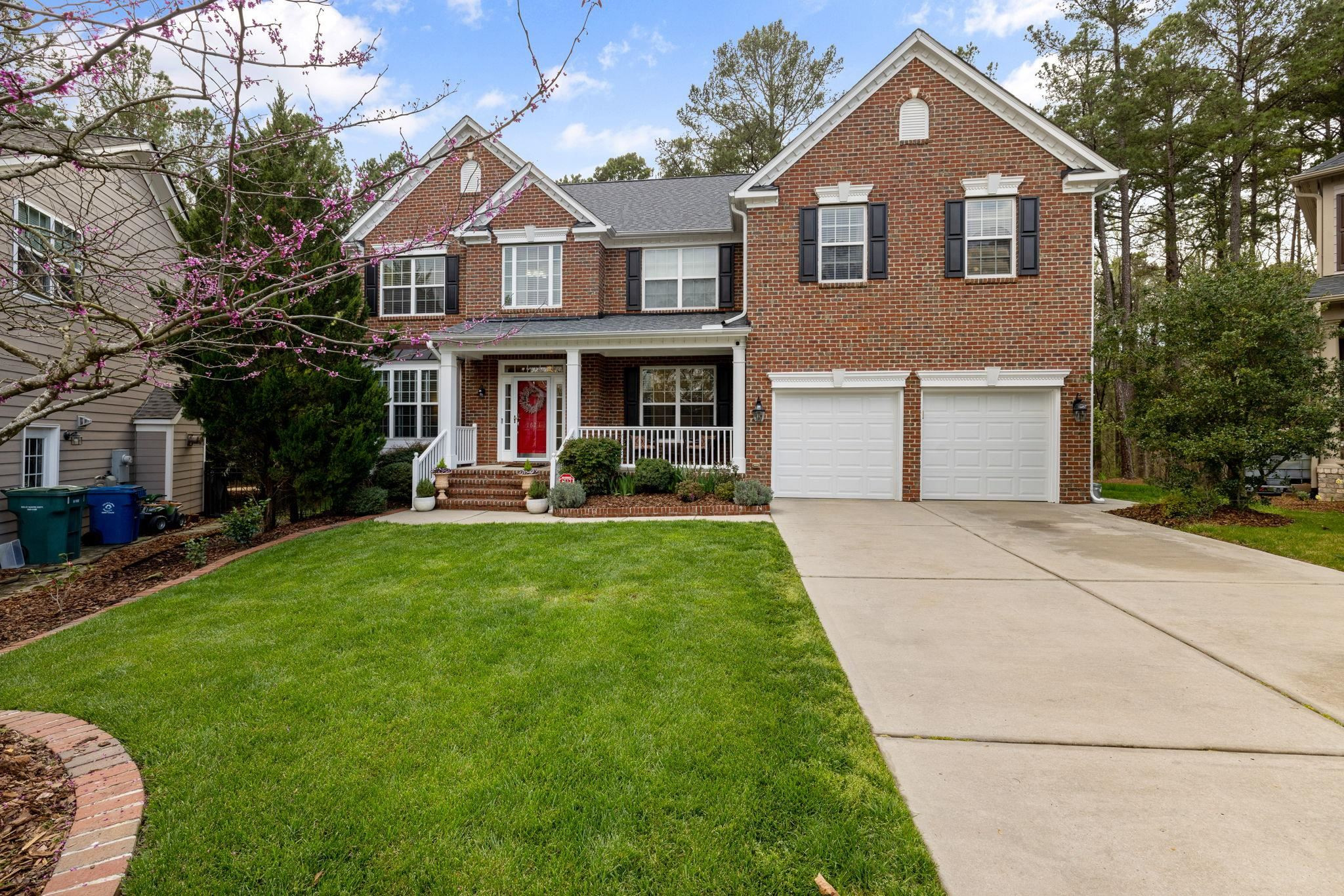 1621 Timber Wolf Drive Durham, NC 27713 - Photo 2 of 48 a front view of a house with a yard and trees