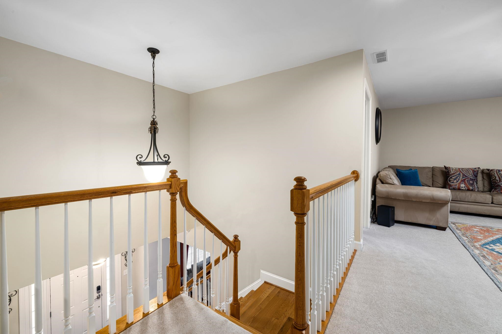 1621 Timber Wolf Drive Durham, NC 27713 - Photo 27 of 48 a view of a livingroom with furniture and stairs